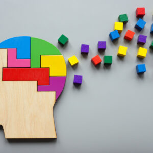 Neurodiversity concept. Head made of colored puzzles. Positivity and creativity.